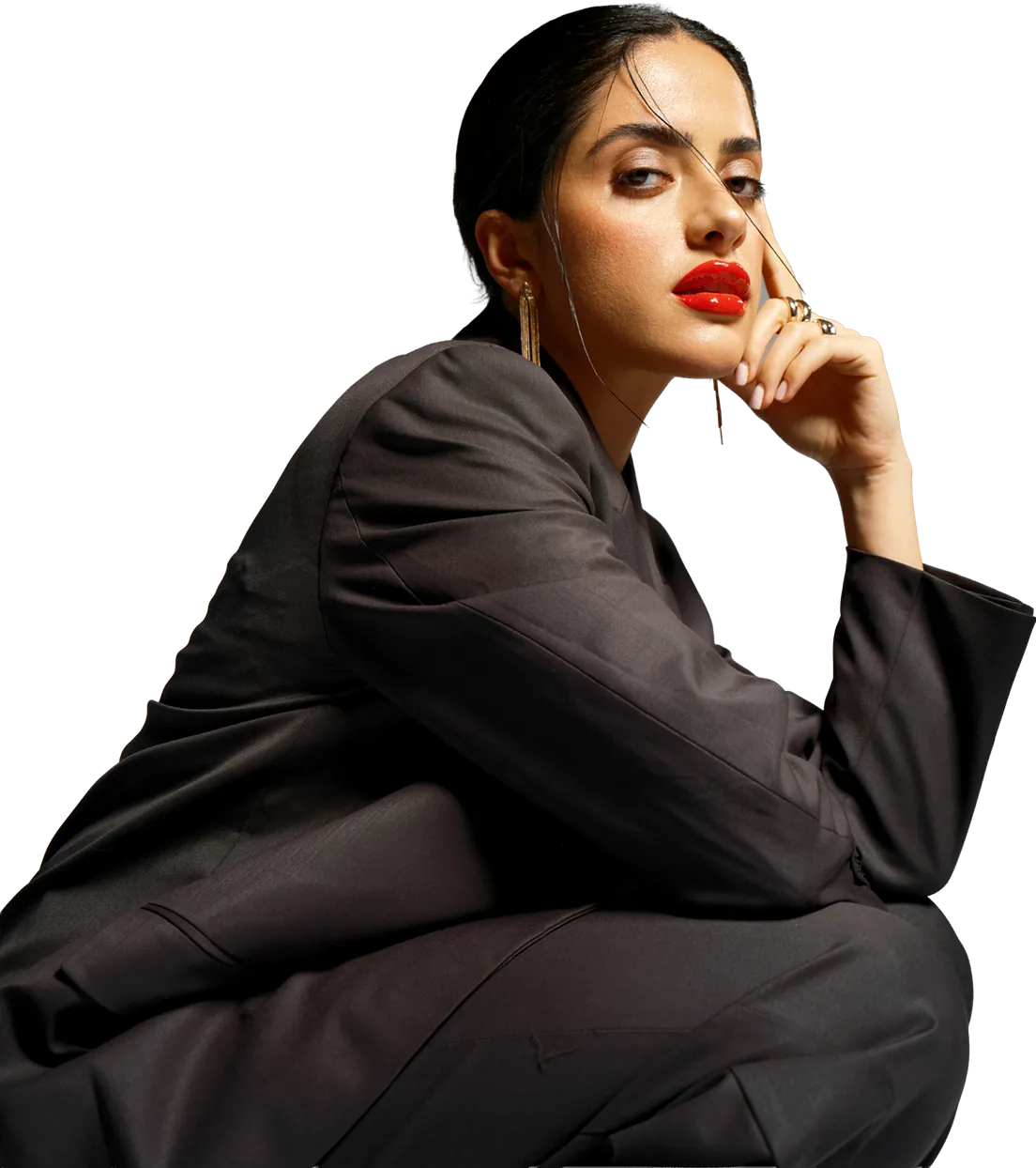 Ogle School student model in an oversized brown blazer with bold red lips