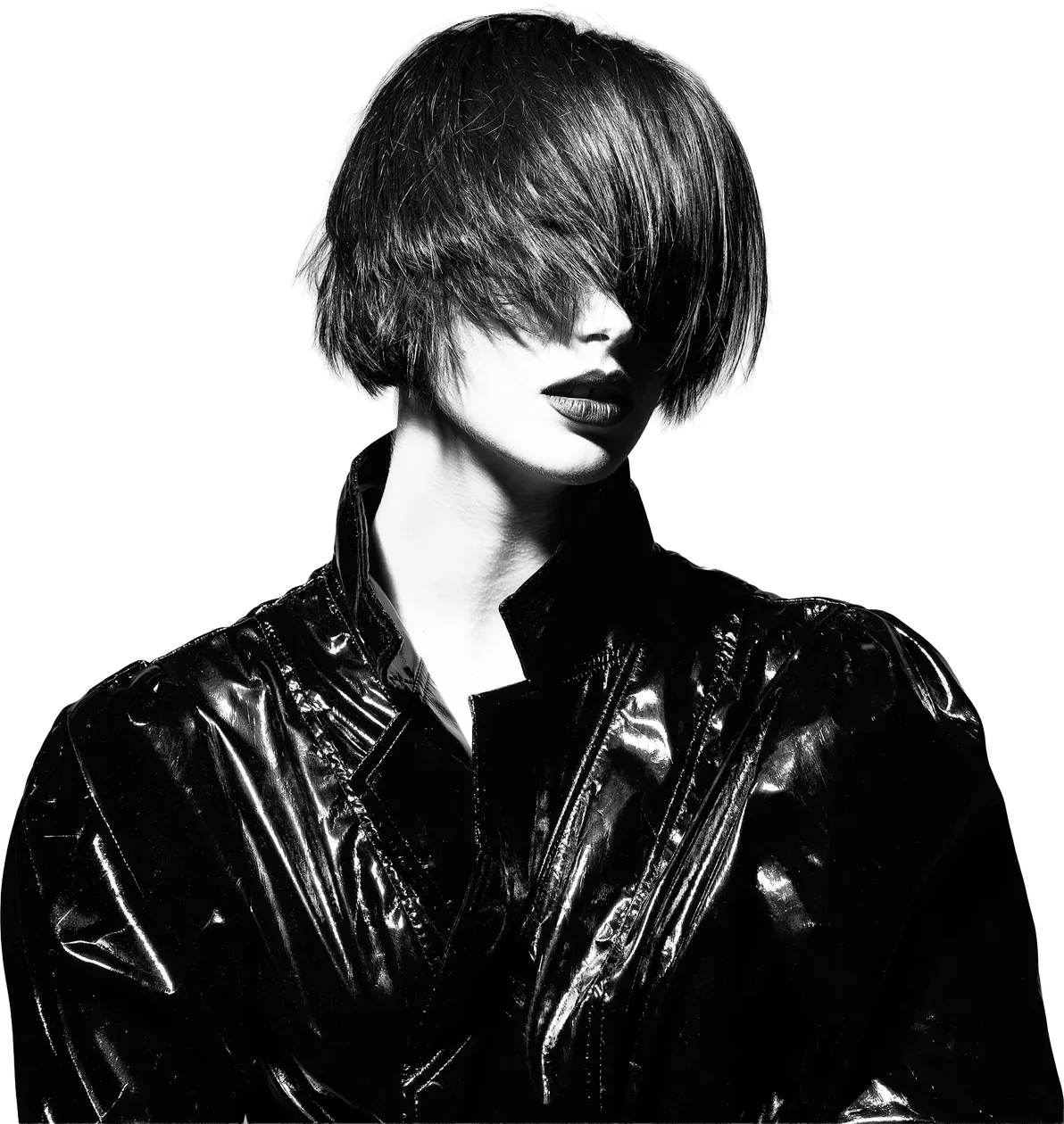 Ogle School student model in a glossy black jacket with a sleek asymmetric cut